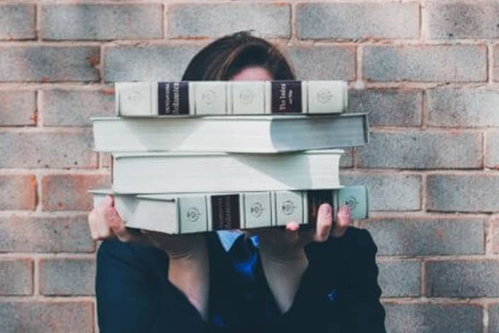 Student Holding Books