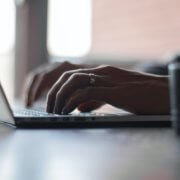 Hands typing on computer taking TEAS